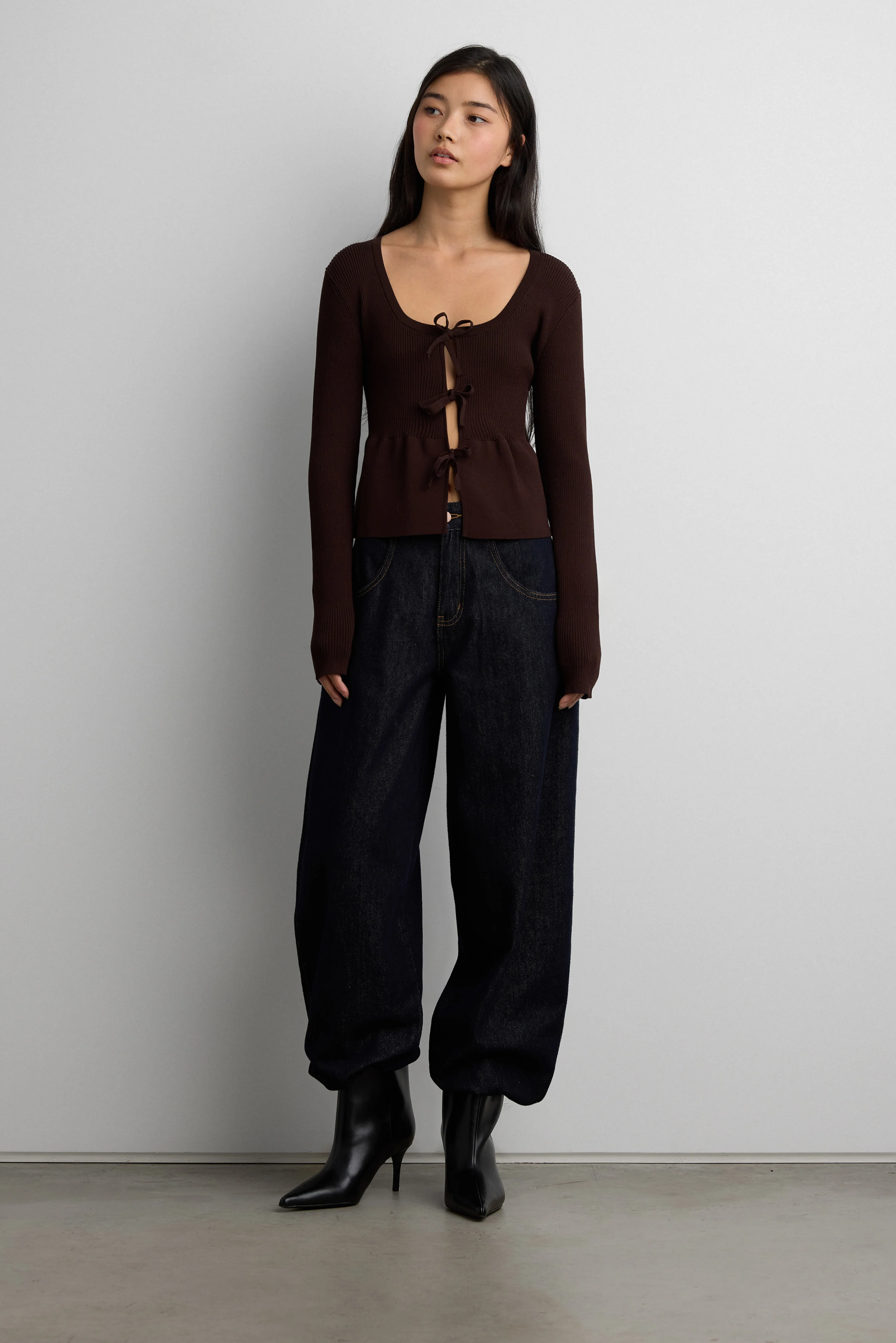 RIBBED TIE FRONT PEPLUM SWEATER